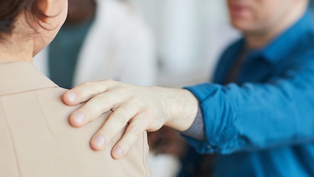 counsellor comforting bereaved person